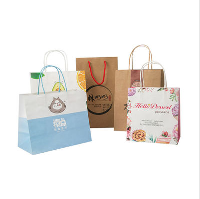 La couleur a imprimé les sacs à provisions de transport écologiques de papier d'emballage avec des poignées
