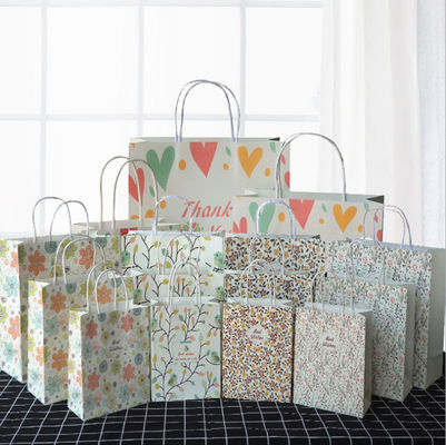 Les sacs en papier réutilisés de rapport forts avec l'anniversaire Papier d'emballage de poignées sortent des sacs